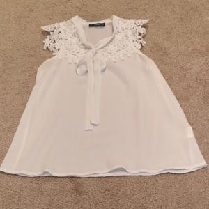 White sleeveless blouse